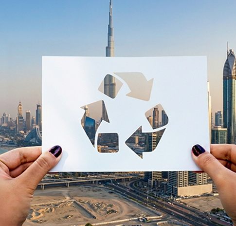 City skyline with recycling symbol